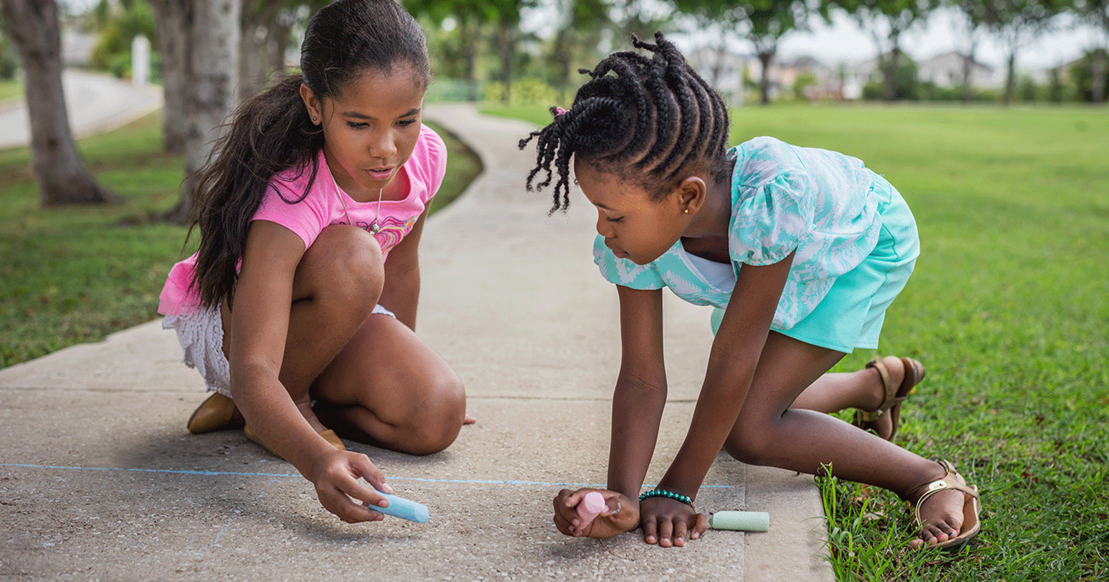 Girls Playing on Sidewalk