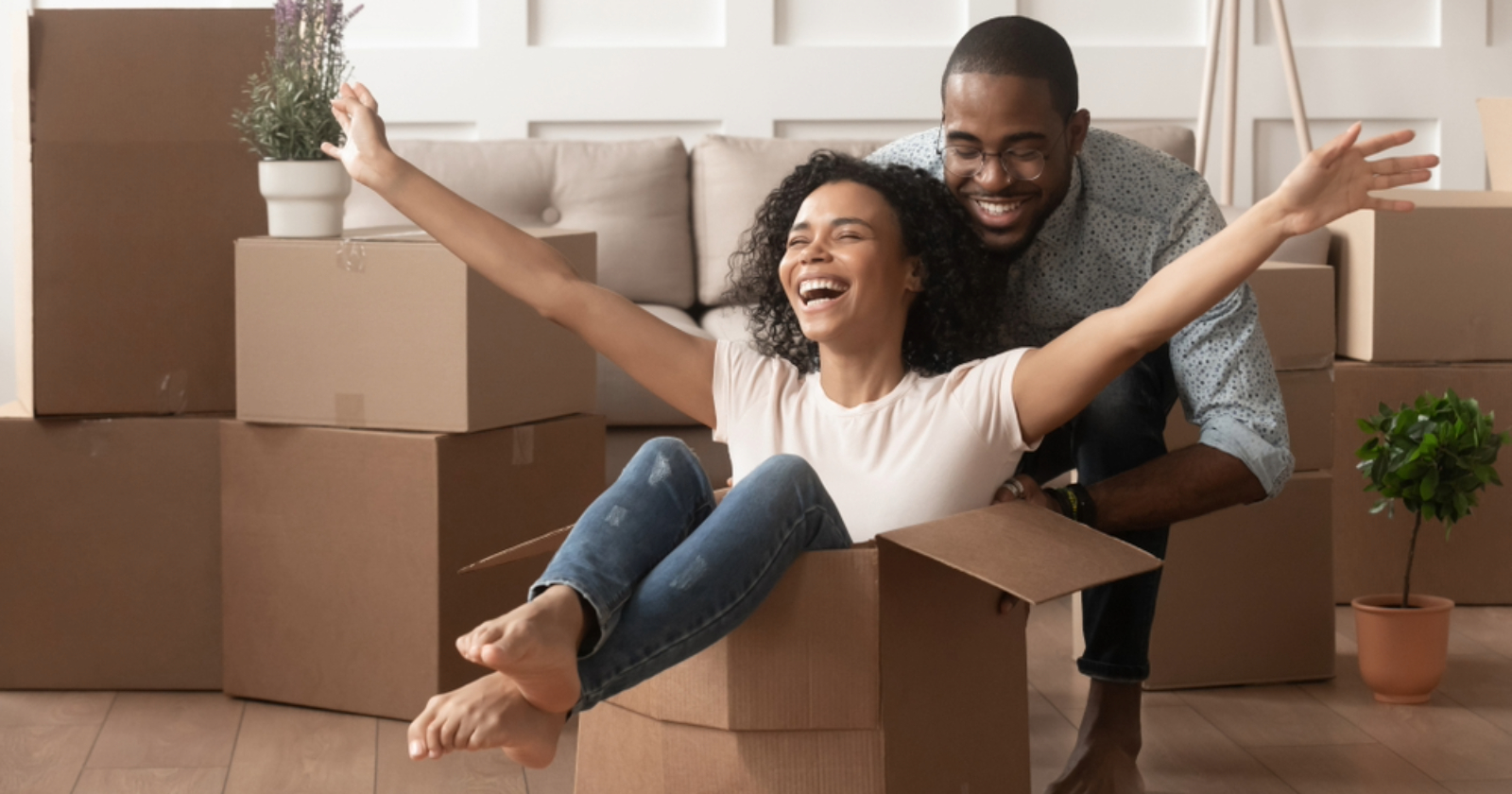 Happy couple moving in home
