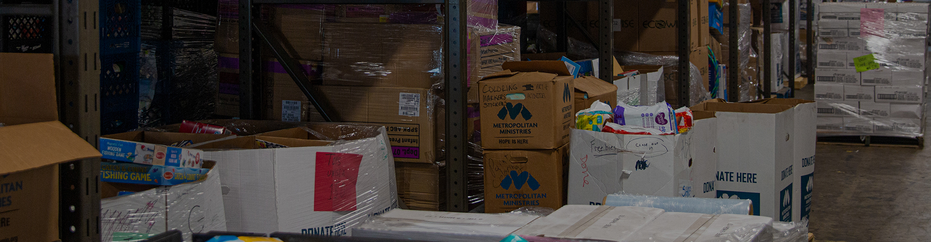 Boxes, full and empty, are seen in a supply room at a charity organization