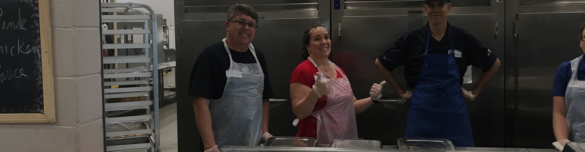 Sagicor employee volunteers help to prepare meals at St. Vincent de Paul in Phoenix