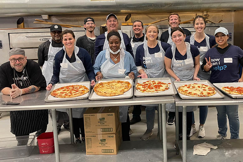 Sagicor employees volunteer at St. Vincent de Paul, making pizzas, in Phoenix, Arizona.